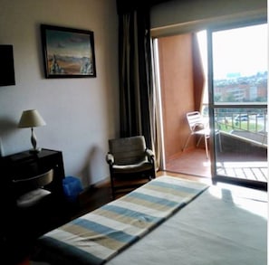 Desk, laptop workspace, free WiFi, bed sheets