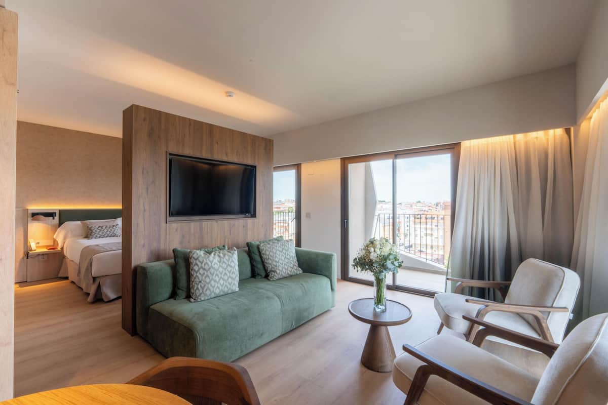 Suite with Balcony | In-room safe, desk, laptop workspace, blackout drapes