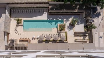 Seasonal outdoor pool, pool umbrellas, pool loungers