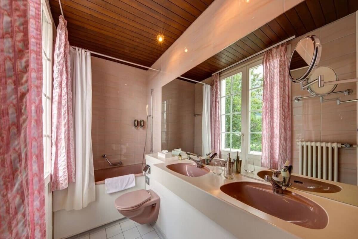 deluxe double room | bathroom | rainfall showerhead, hair dryer, towels