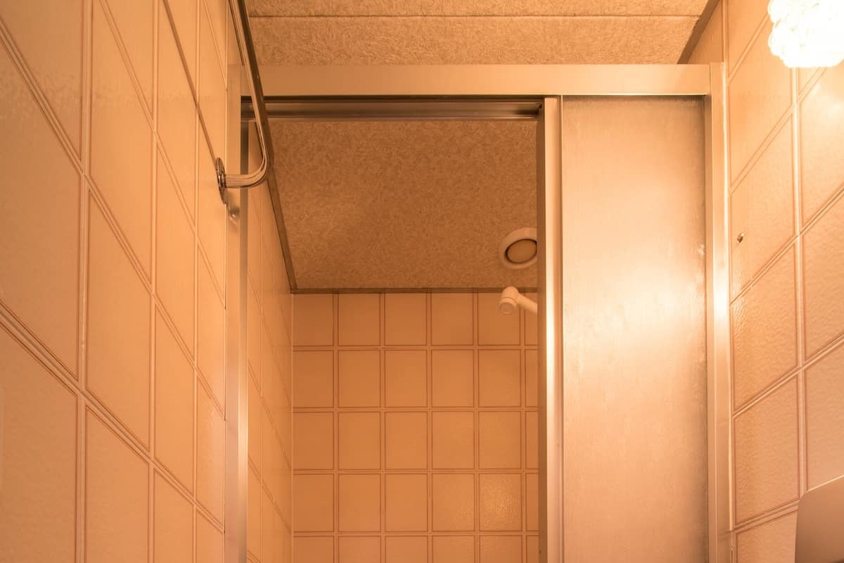 A bathroom with a bathtub, a shower, and a toilet.