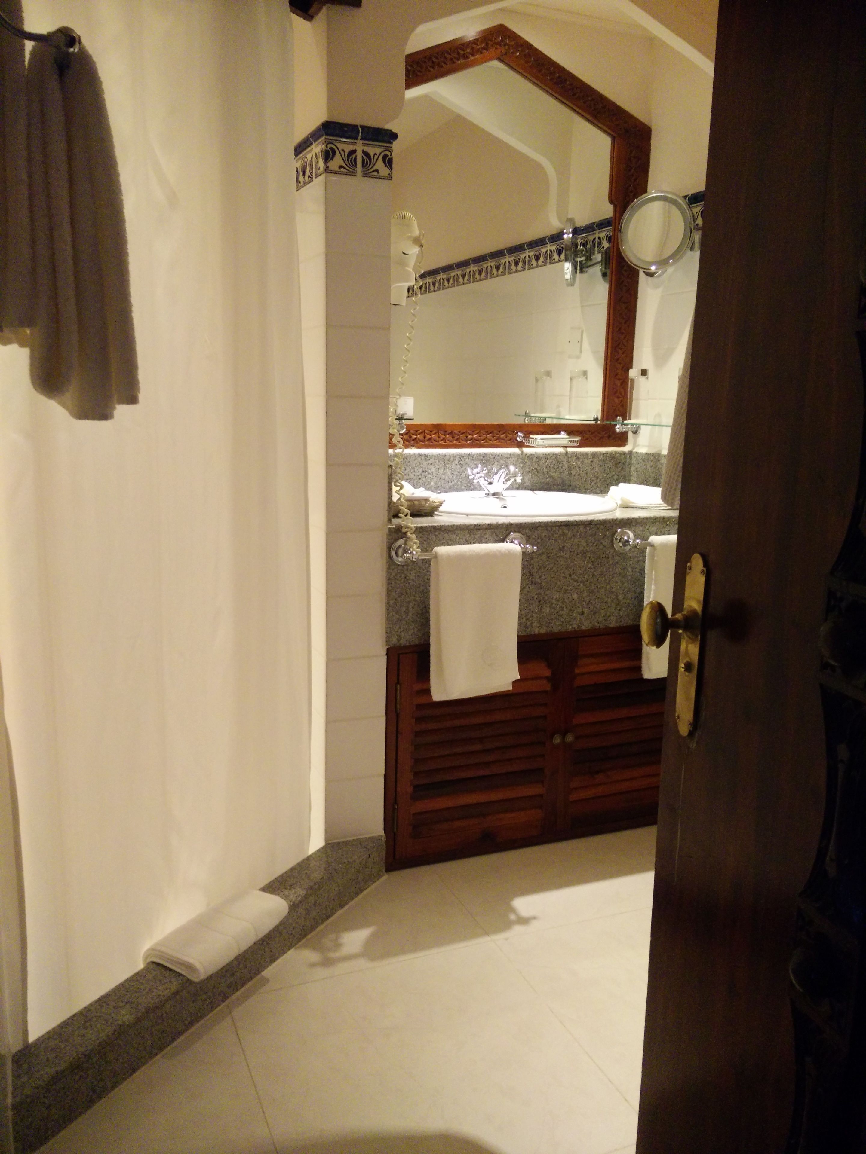 separate bathtub and shower, designer toiletries, hair dryer, bathrobes