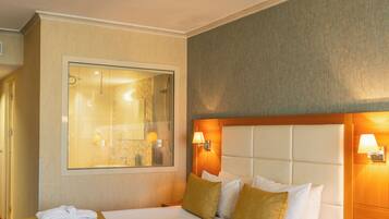 Premium bedding, pillow-top beds, minibar, in-room safe