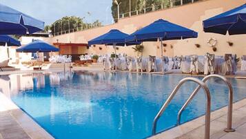 Seasonal outdoor pool, open 10:30 AM to 6:00 PM, pool loungers