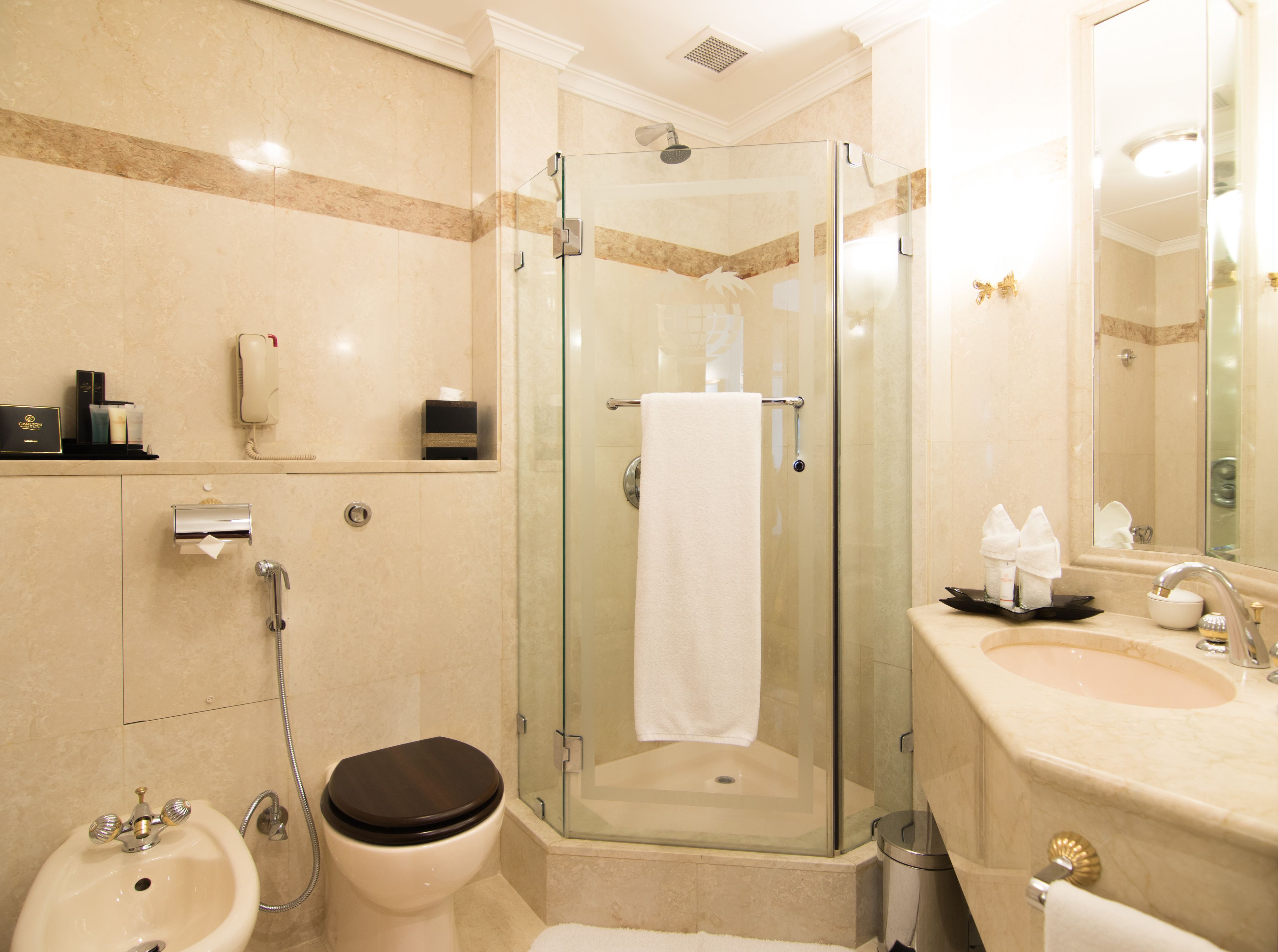 bathtub, designer toiletries, hair dryer, dressing gowns