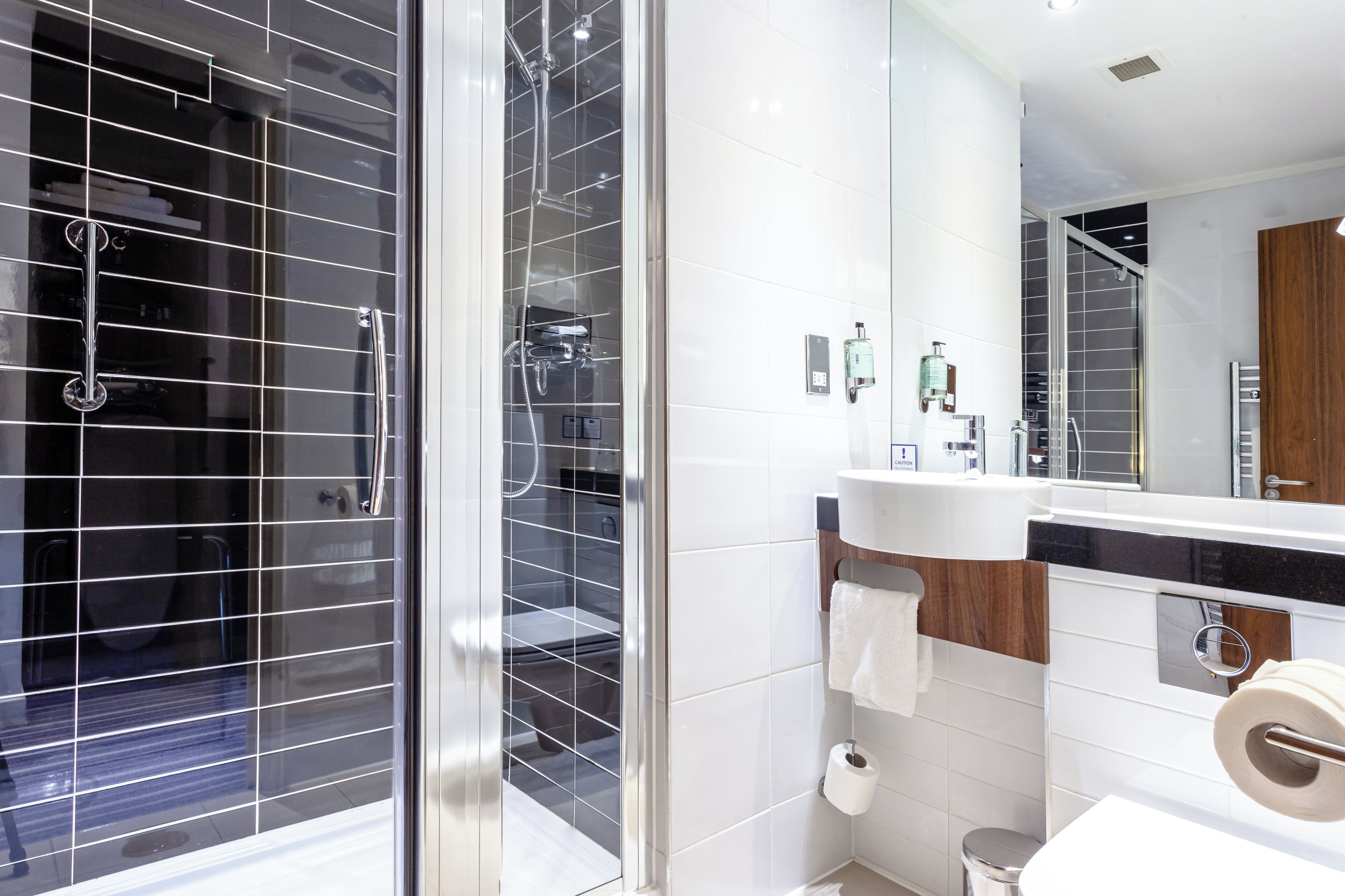 Shower, eco-friendly toiletries, hair dryer, towels