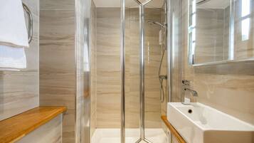 Shower, free toiletries, hair dryer, towels