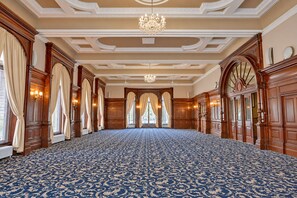 A spacious hall with a patterned carpet, wooden paneling, and a chandelier. - The Victoria Hotel, Bradford by Sunday (Bradford)