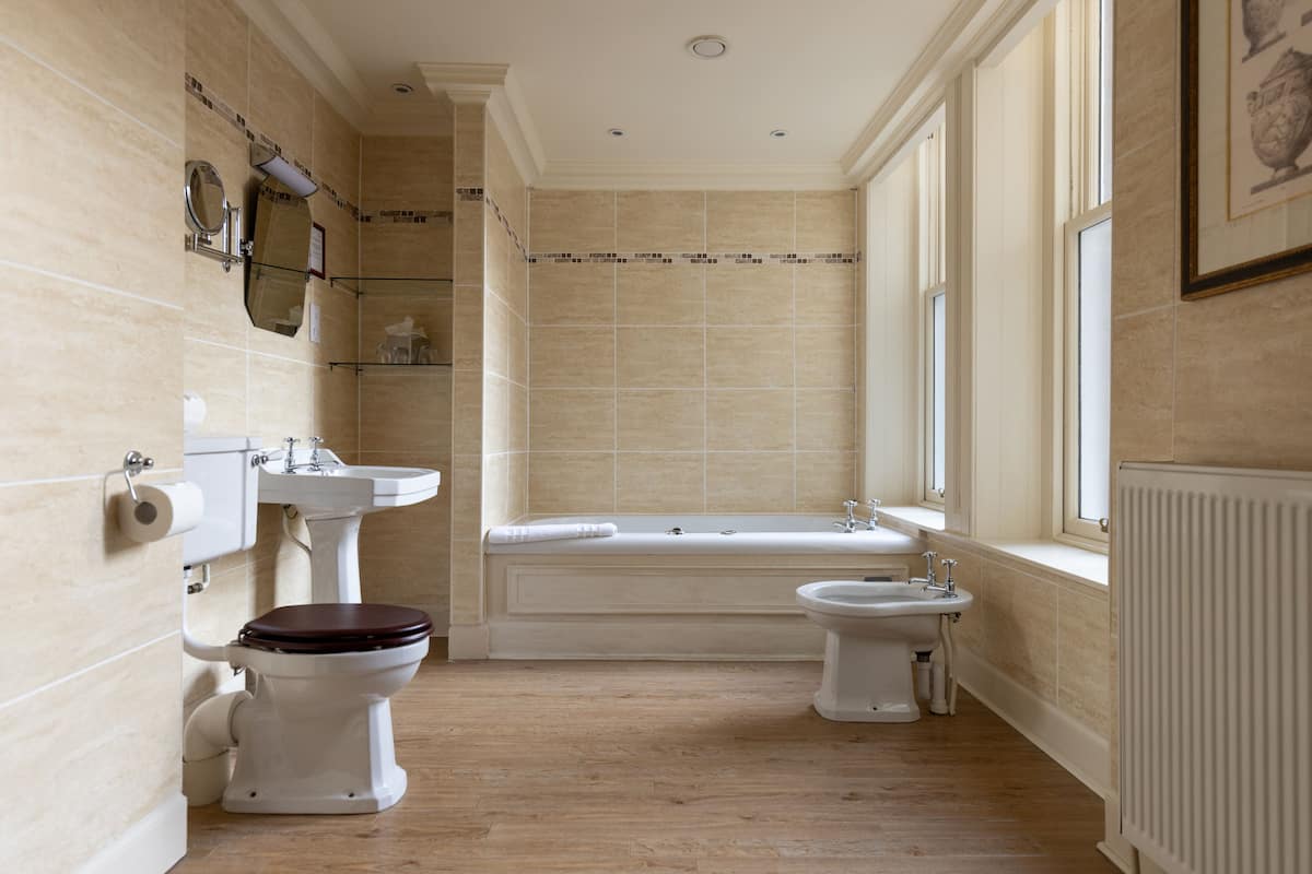 classic suite | bathroom | separate bathtub and shower, eco-friendly toiletries, hair dryer, bidet