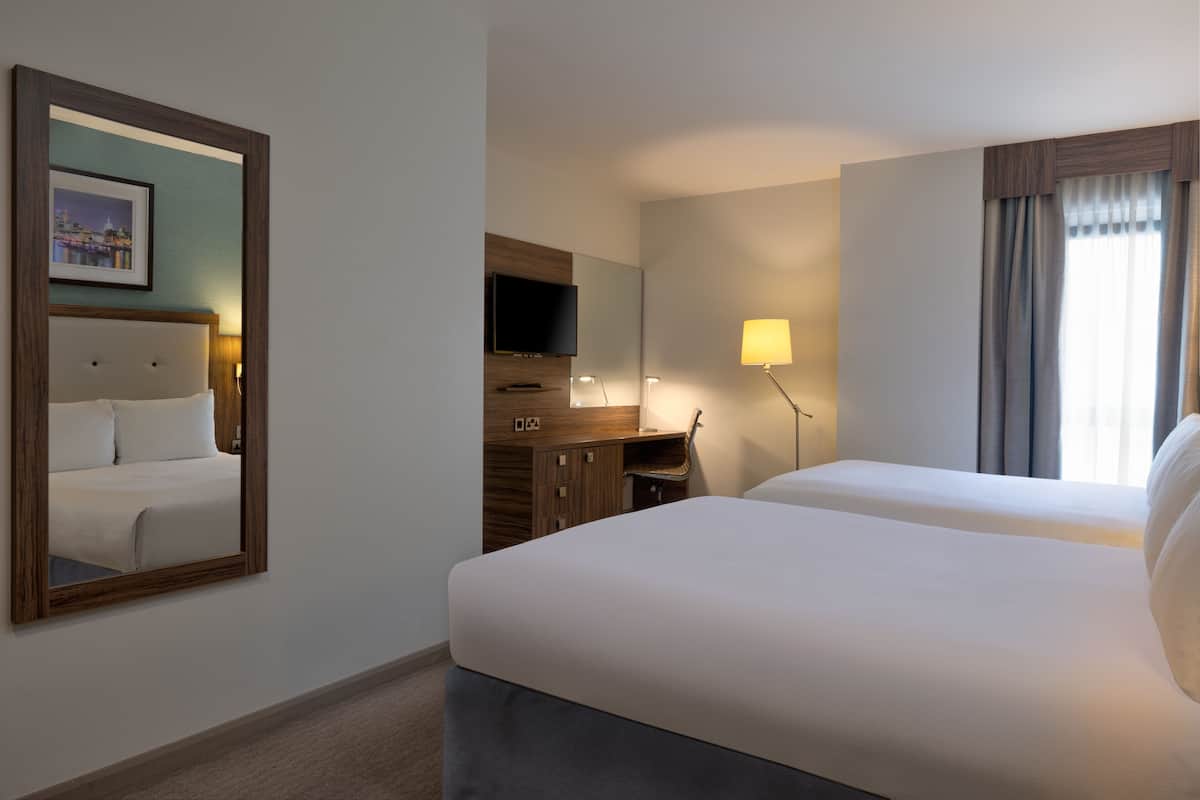 Deluxe Room, 2 Queen Beds | Hypo-allergenic bedding, in-room safe, desk, laptop workspace