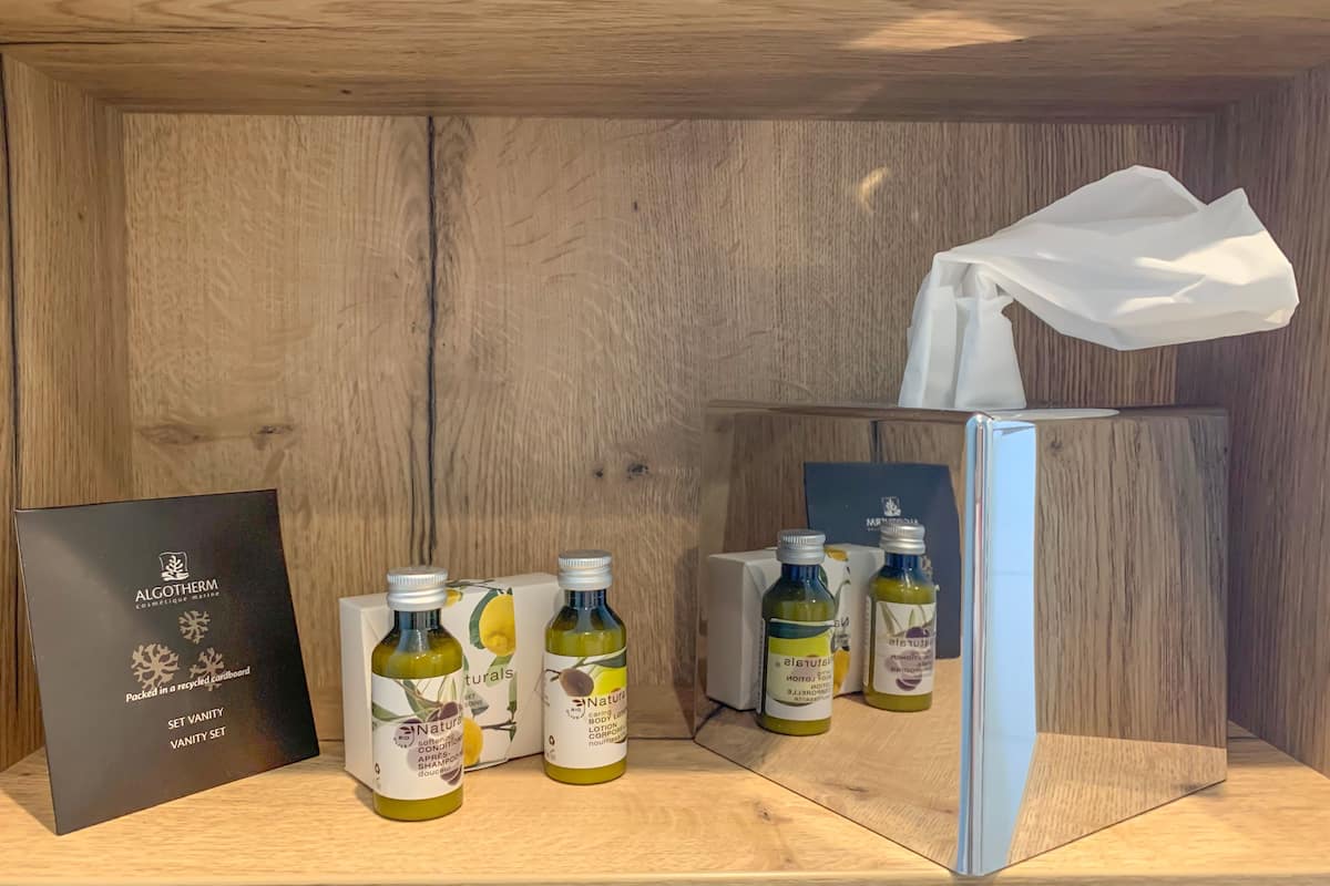 eco-friendly toiletries, hair dryer, towels, soap