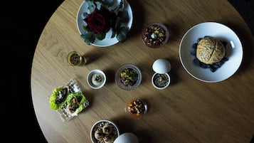 A variety of food items arranged on a wooden table.