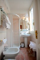 Economy Room | Bathroom | Shower, free toiletries, hair dryer, slippers