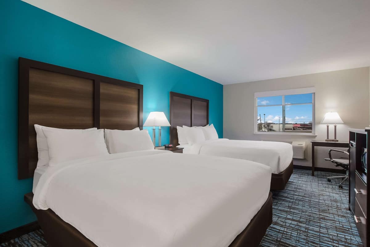 Standard Room, 2 Queen Beds, Non Smoking | In-room safe, desk, iron/ironing board, free cribs/infant beds