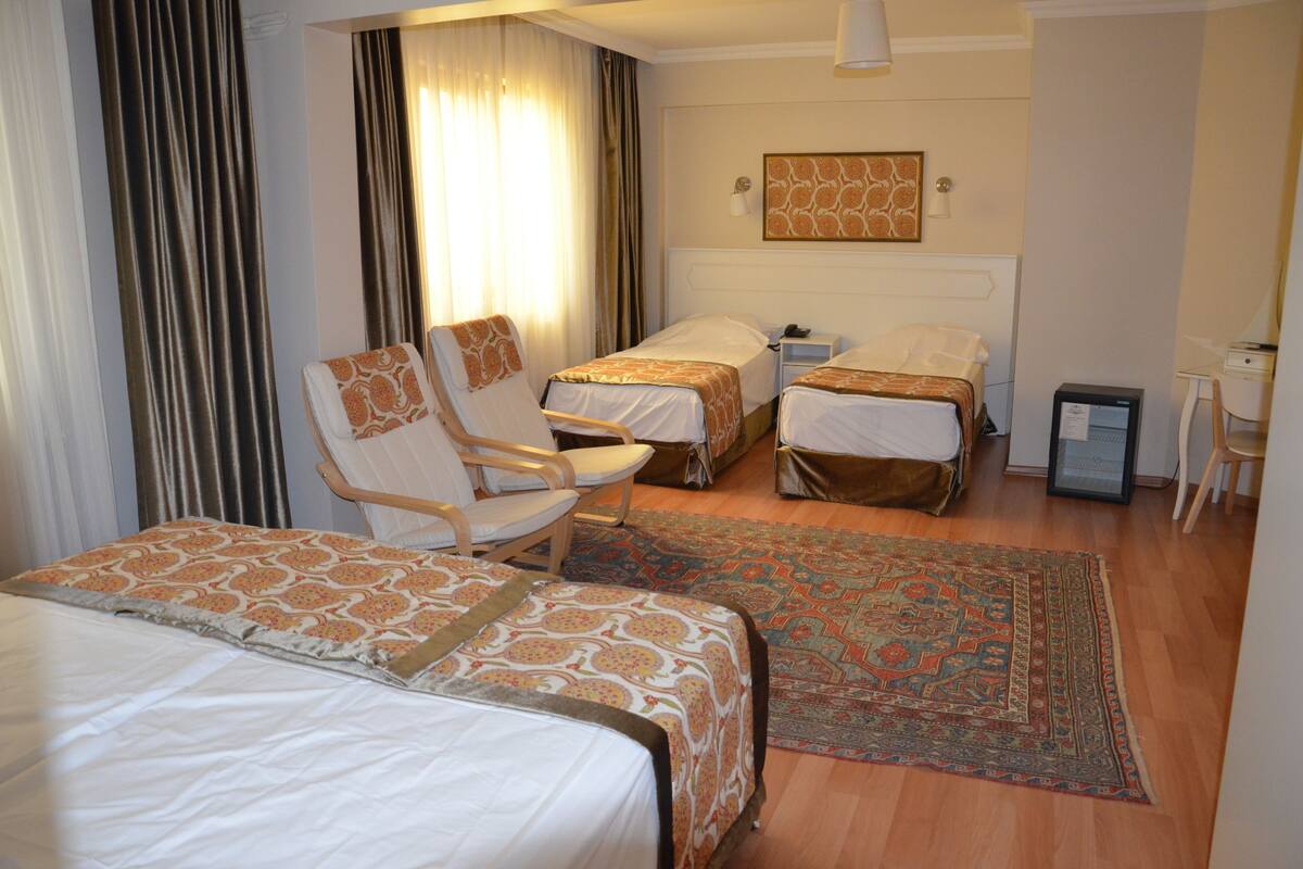 Family Quadruple Room, Multiple Beds | Living area