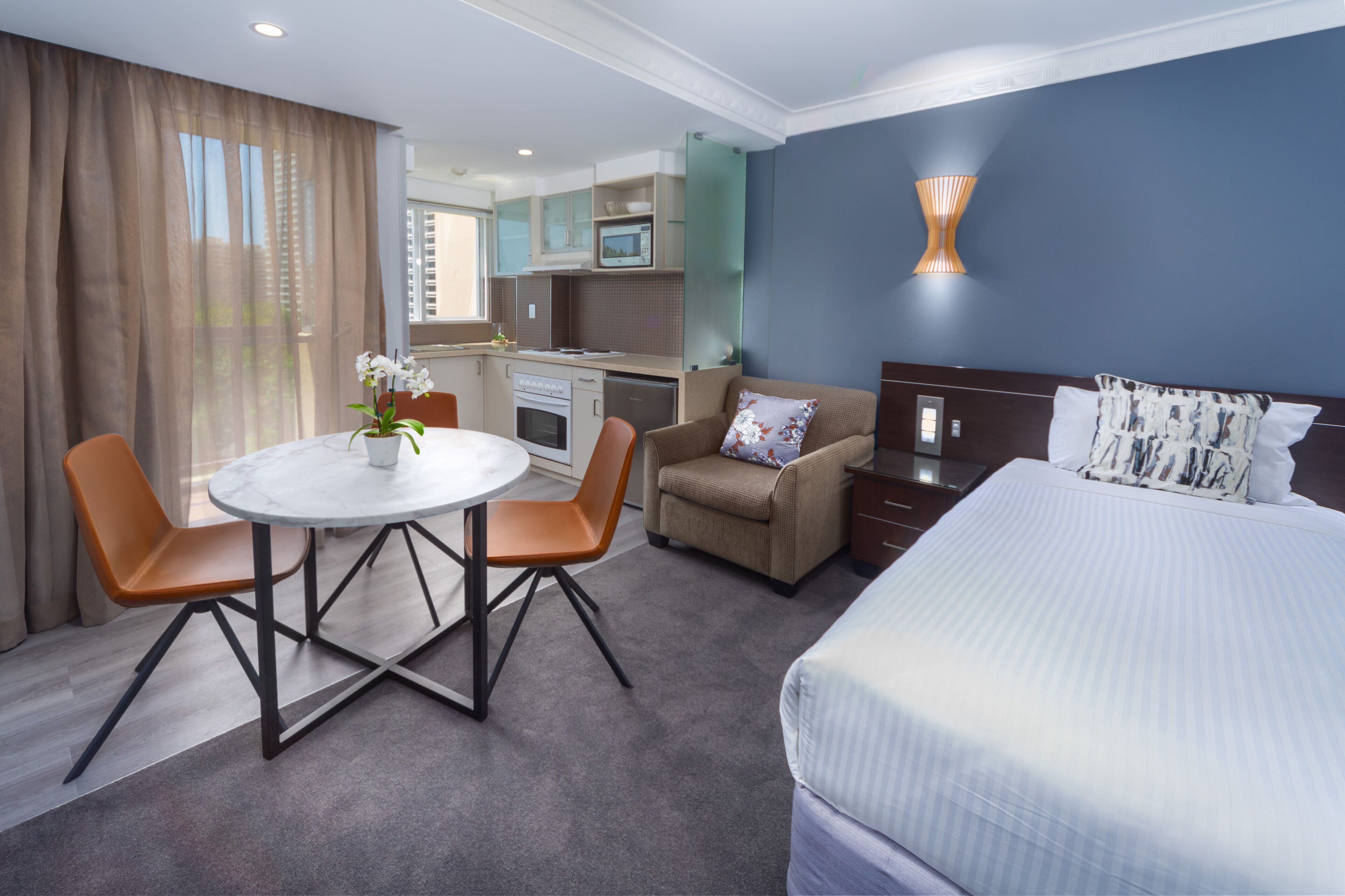 deluxe family room - 4 people + light breakfast placed in room | living area | 40-inch lcd tv with cable channels, tv, dvd player