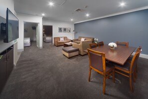 Back 2 Bedroom Apartment 201 (No View) + Light Breakfast placed in Room | Living area | 40-inch LCD TV with cable channels, TV, DVD player