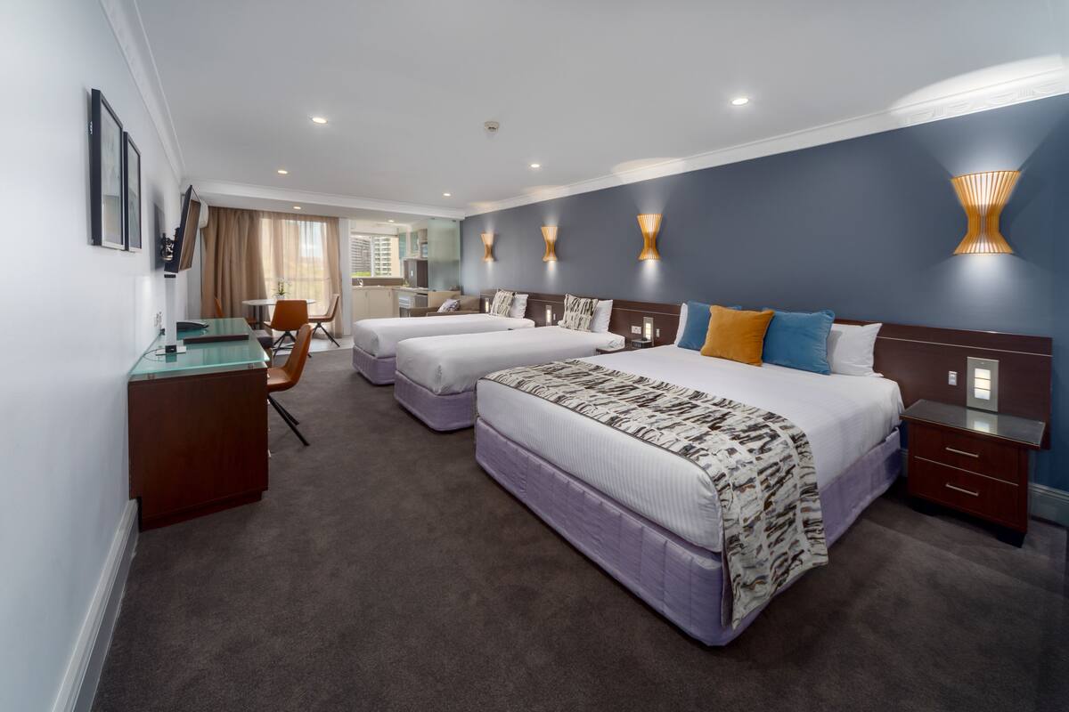 Deluxe Family Room - 4 People + Light Breakfast placed in Room | In-room safe, desk, soundproofing, iron/ironing board