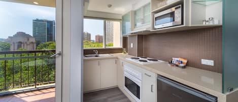 Deluxe Family Room - 4 People + Light Breakfast placed in Room | Private kitchenette | Fridge, coffee/tea maker