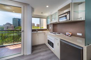 Deluxe Family Room - 4 People + Light Breakfast placed in Room | Private kitchenette | Coffee/tea maker, fridge