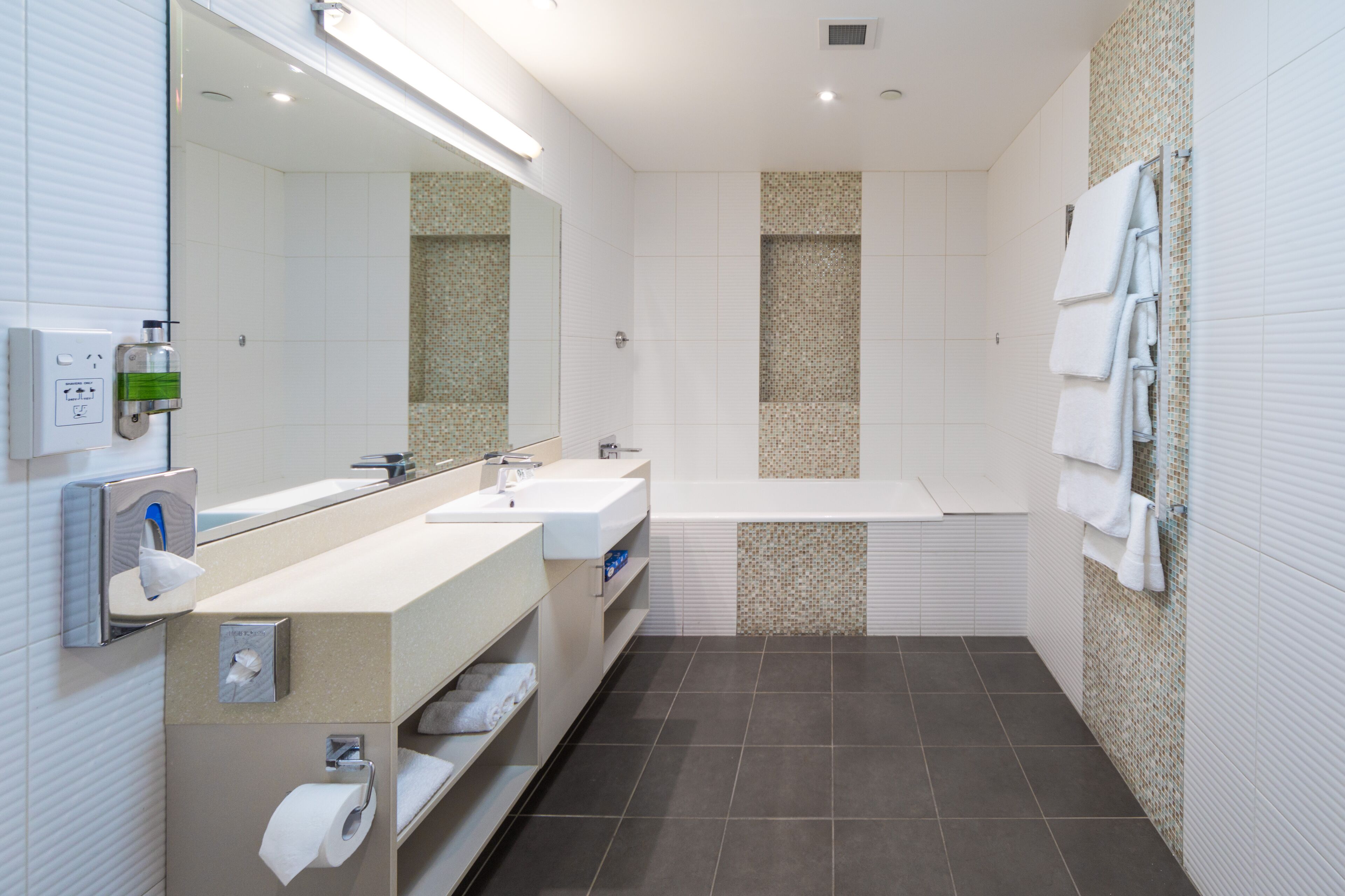 back 2 bedroom apartment 201 (no view) + light breakfast placed in room | bathroom | shower, hair dryer, towels