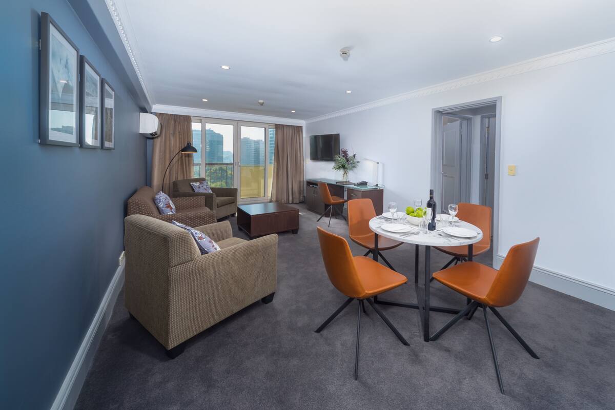 Two Bedroom Front Apartment + Light Breakfast placed in Room | Living area | 40-inch LCD TV with cable channels, TV, DVD player