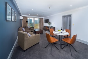 Two Bedroom Front Apartment + Light Breakfast placed in Room | Living area | 40-inch LCD TV with cable channels, TV, DVD player