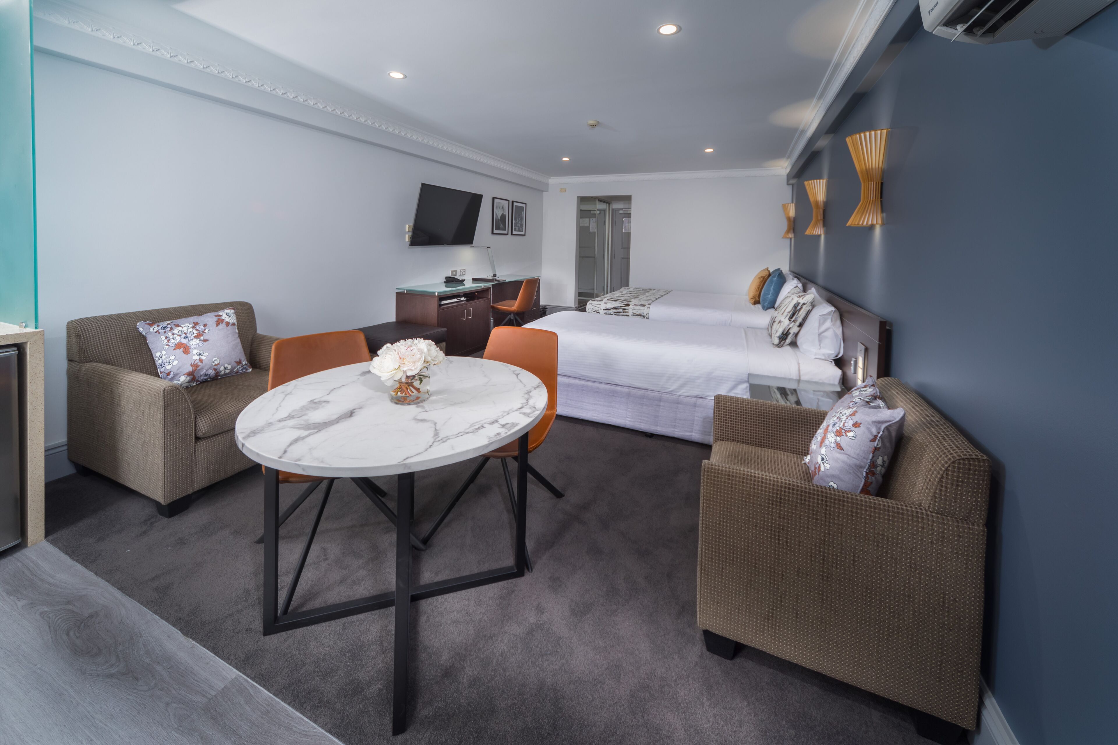 deluxe studio + light breakfast placed in room | in-room safe, desk, soundproofing, iron/ironing board