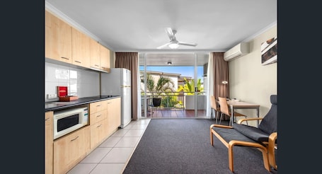 Classic Studio | Living area | 40-inch TV with digital channels