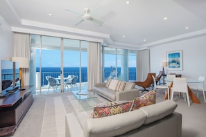 Two Bedroom Executive Front Ocean View | Living area | 55-inch flat-screen TV with cable channels, TV, DVD player