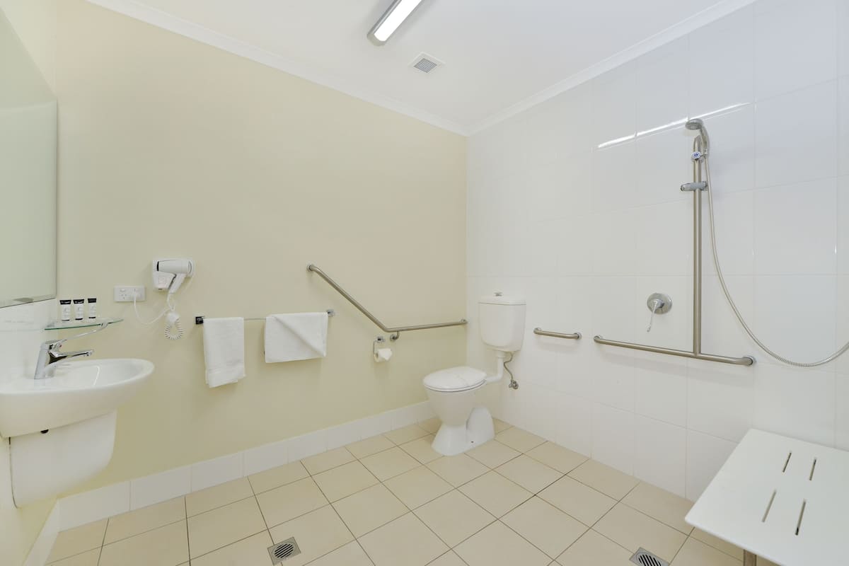 deluxe room, accessible | bathroom | shower, rainfall showerhead, hair dryer, towels