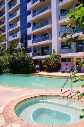 Relax by the pool surrounded by lush greenery and lounge in style with comfortable seating.
