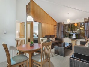 Classic Suite, 2 Bedrooms, Kitchenette | Living area | 82-cm LCD TV with cable channels, TV, pay films