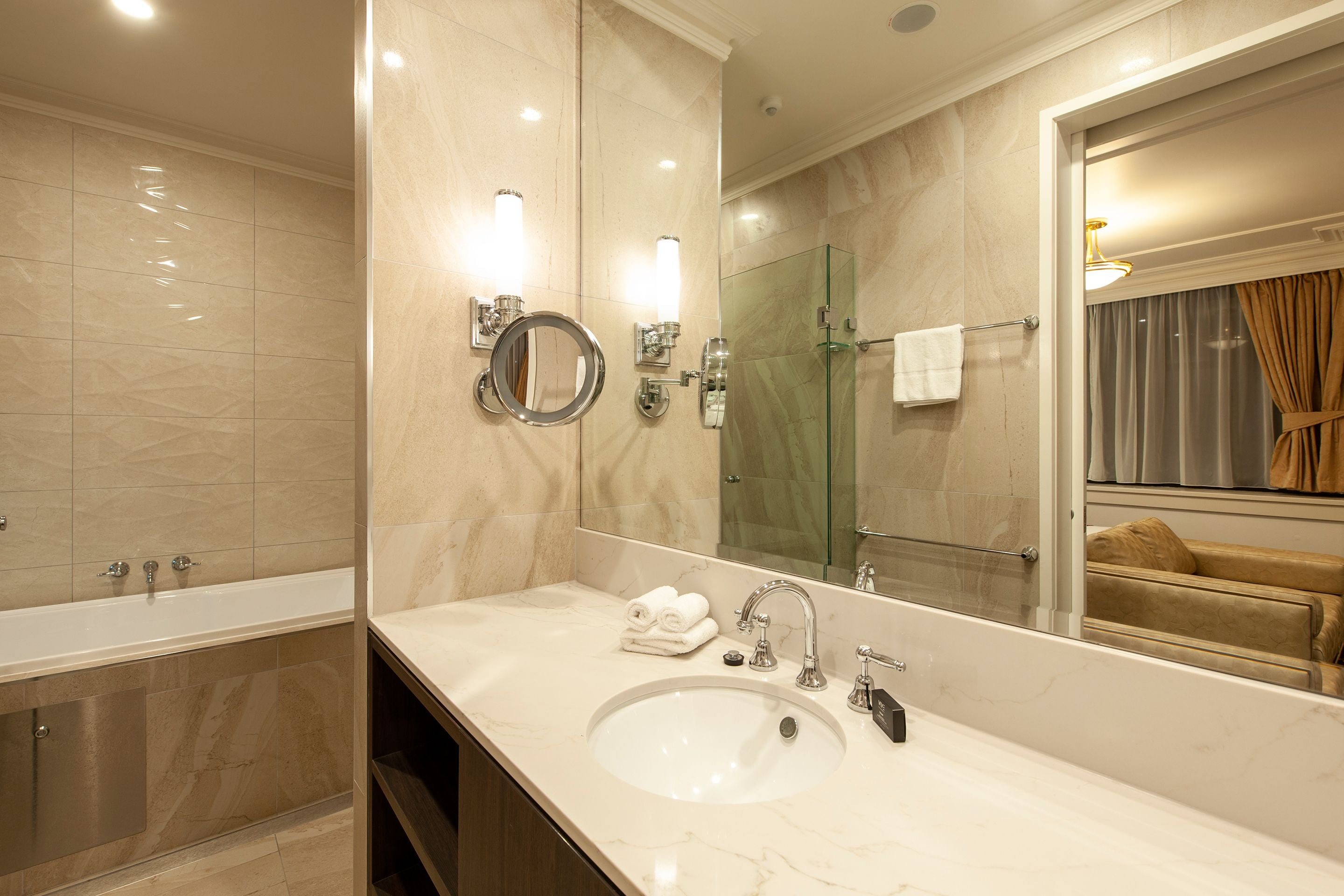 designer toiletries, hair dryer, towels, soap