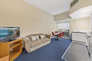 One Bedroom Apartment | Living room | 24-inch LCD TV with digital channels, TV