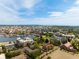 A cityscape with a prominent waterfront, historic buildings, and a mix of modern architecture.