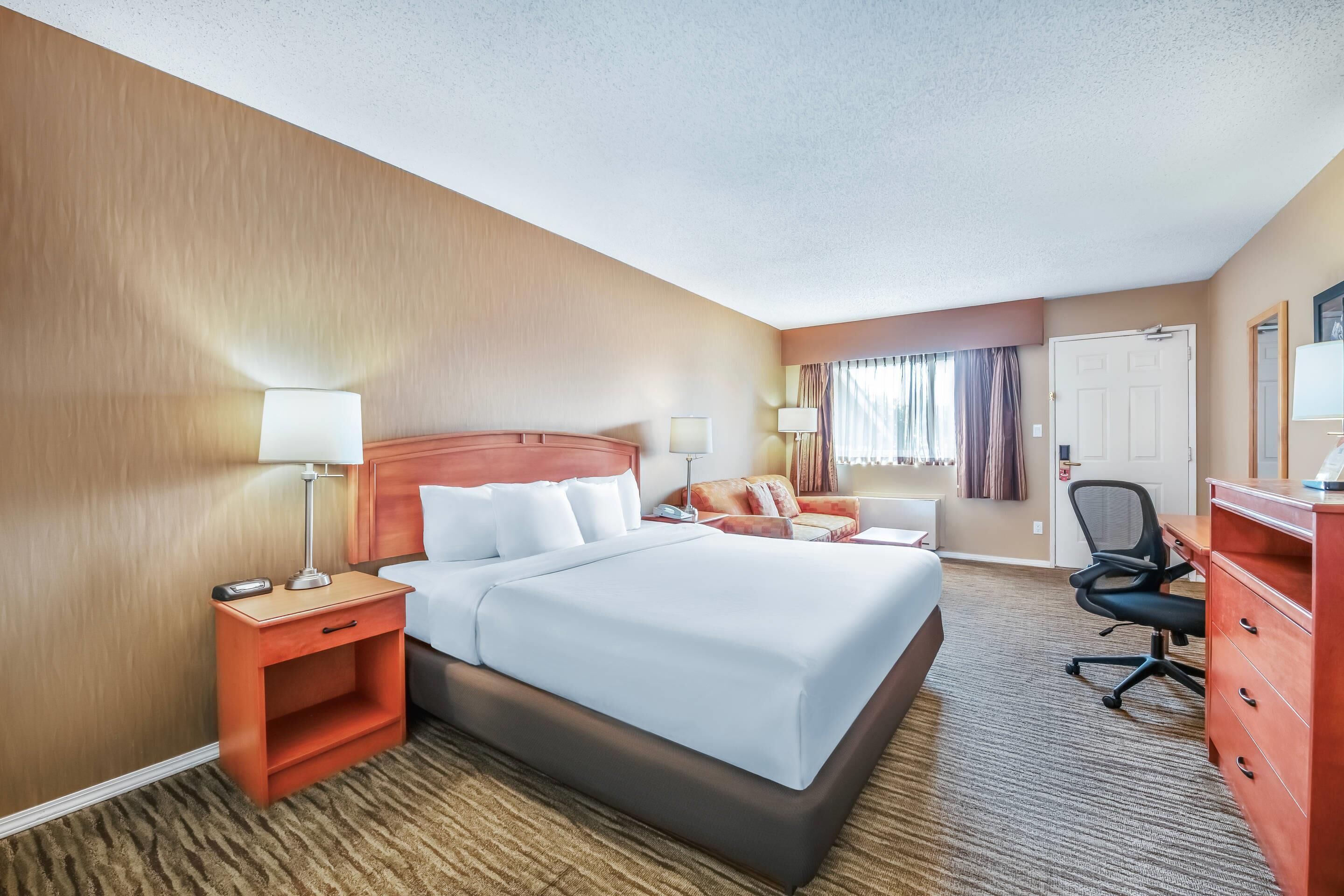 Premium bedding, desk, blackout curtains, iron/ironing board