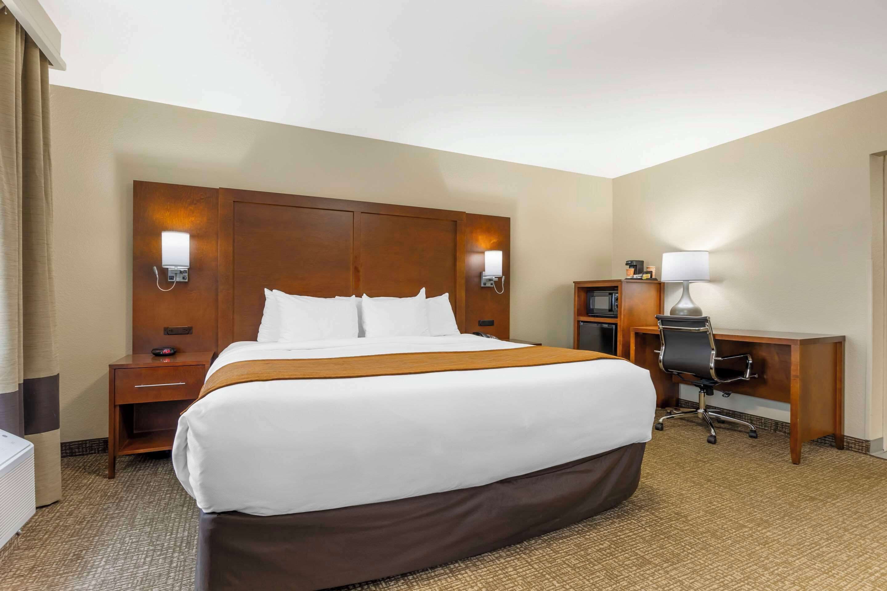 premium bedding, desk, blackout curtains, iron/ironing board