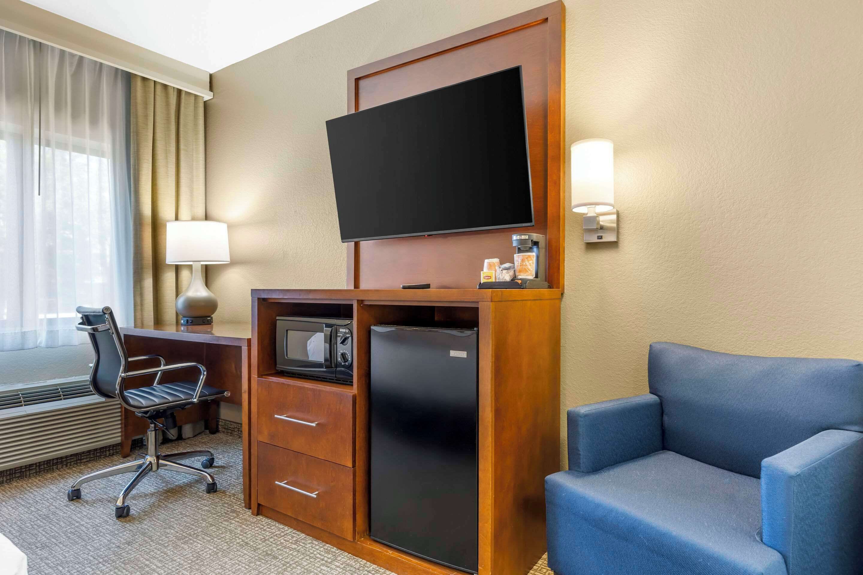 premium bedding, desk, blackout curtains, iron/ironing board