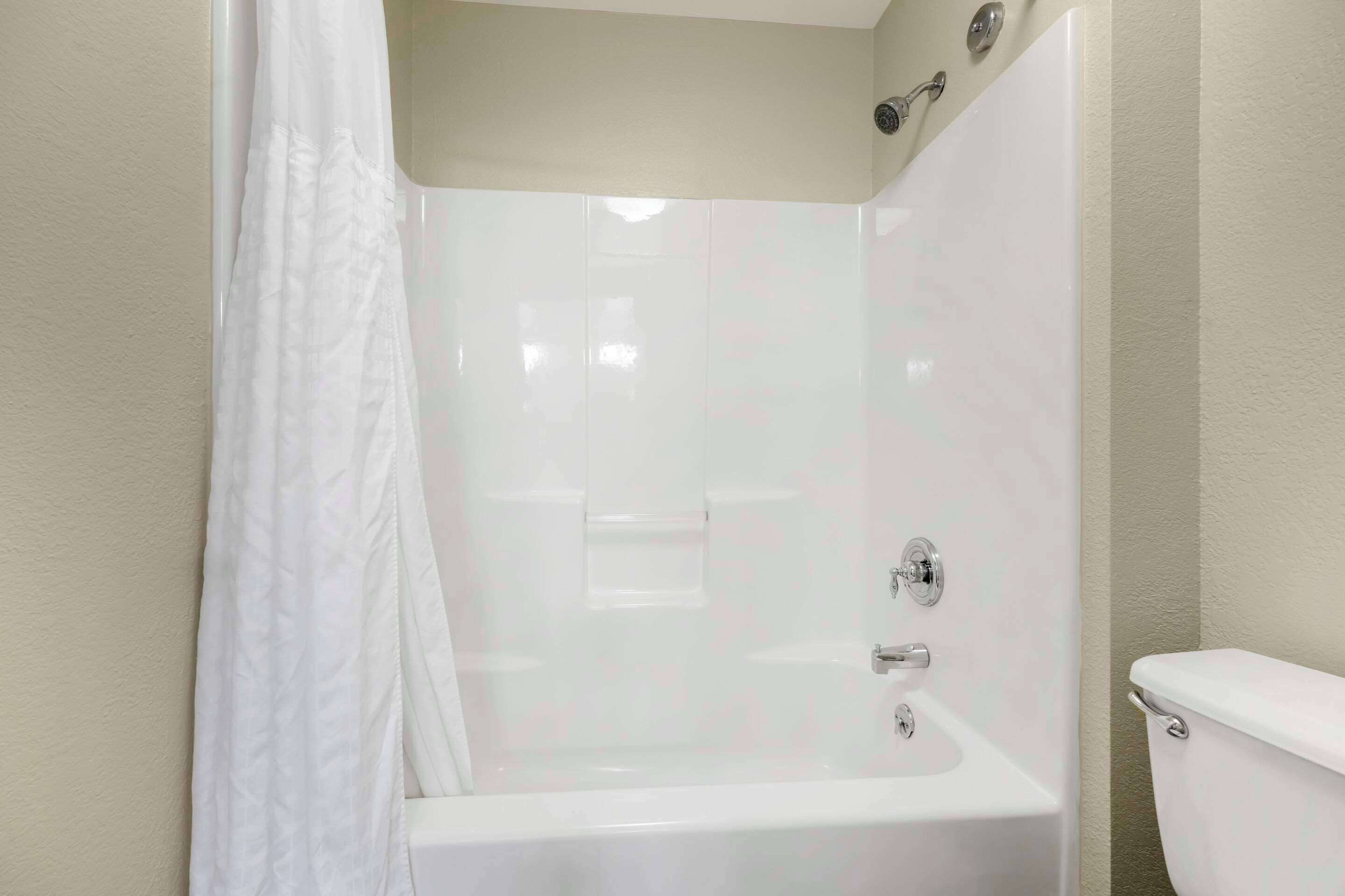 premium bedding, desk, blackout curtains, iron/ironing board