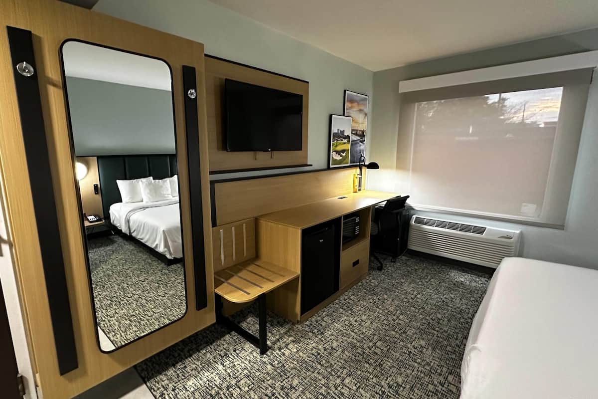 Desk, blackout drapes, iron/ironing board, free cribs/infant beds