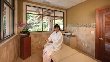 Enjoy a peaceful retreat with a view from the large window, a comfortable bed, and a convenient sink area.