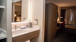 A hotel bathroom with a sink, mirror, and toiletries. - Holiday Inn Express Airport - Tucson by IHG (Tucson)