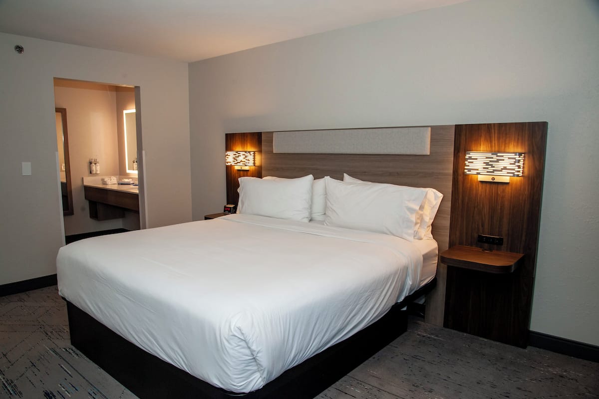 Suite, 1 King Bed (Extra Living Area) | Desk, laptop workspace, iron/ironing board, free WiFi