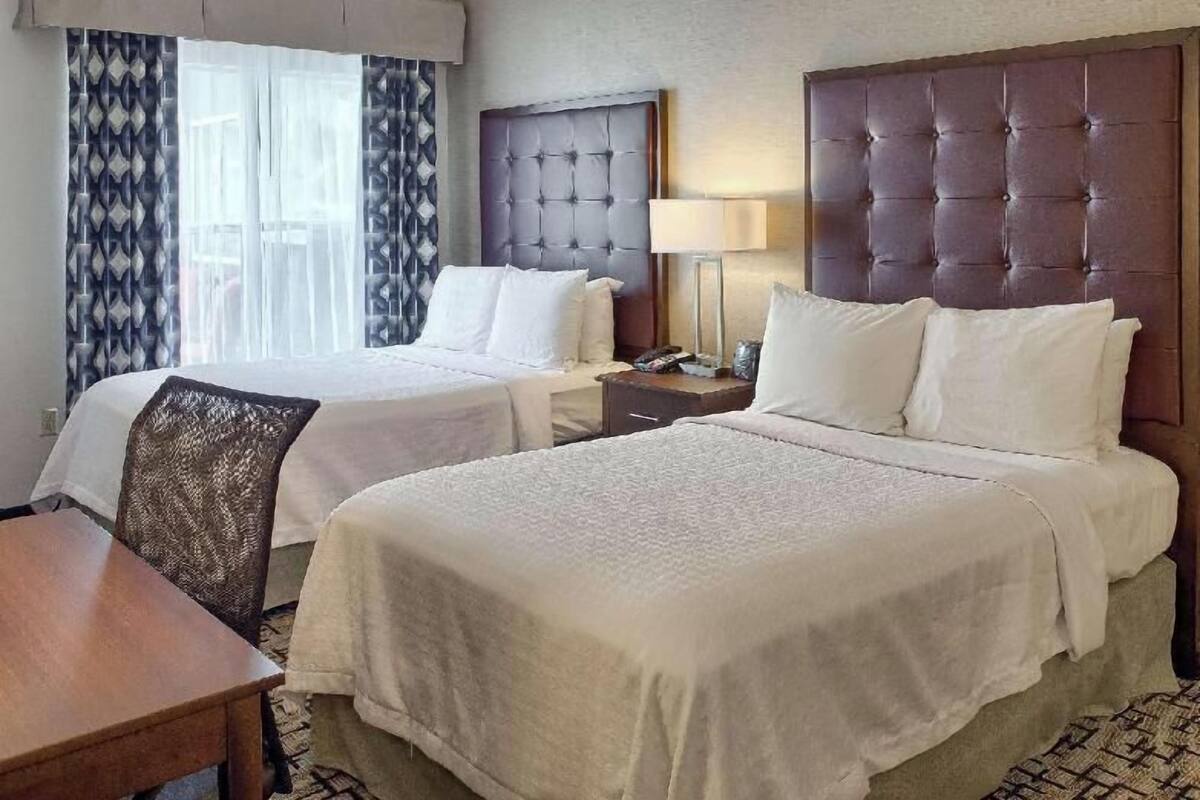 Premium bedding, down comforters, desk, iron/ironing board