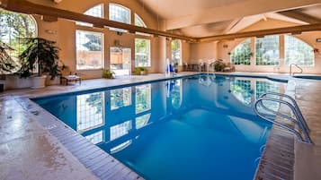 Indoor pool, open 7:00 AM to 11:00 PM, pool loungers