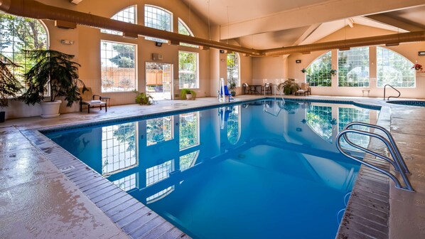 Indoor pool, open 7:00 AM to 11:00 PM, pool loungers