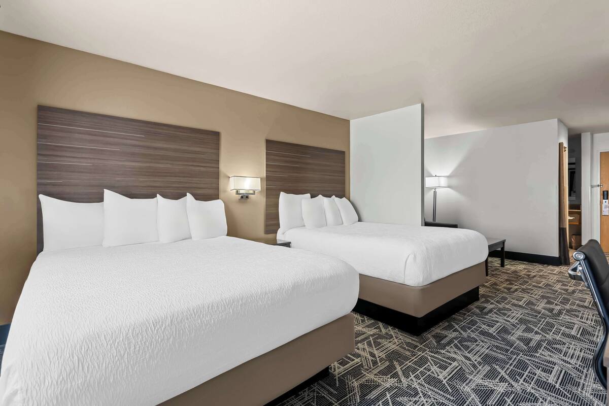 suite, 2 queen beds, non smoking (larger room) | premium bedding, individually decorated, individually furnished, desk