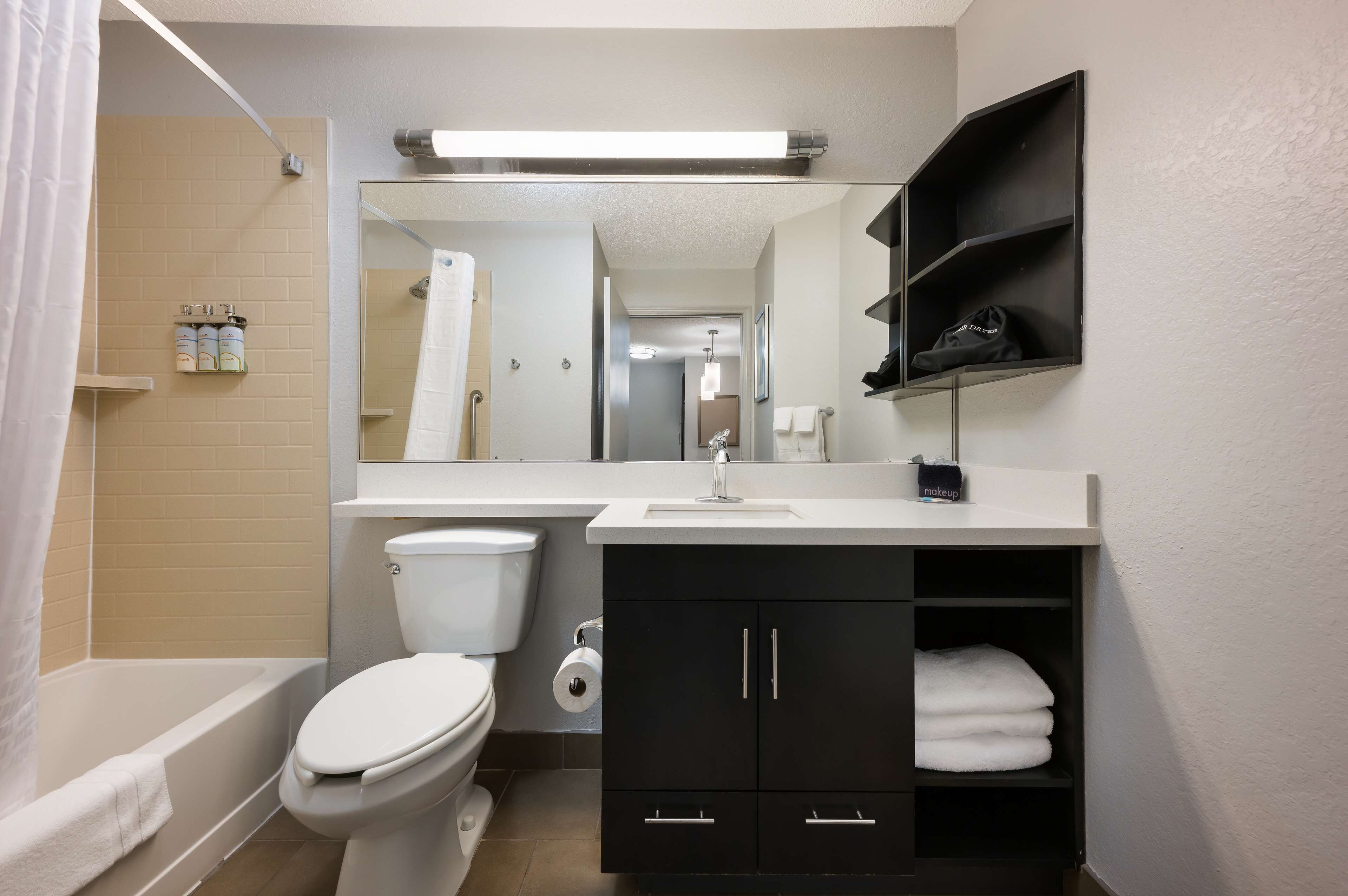 combined shower/bathtub, hair dryer, towels, soap