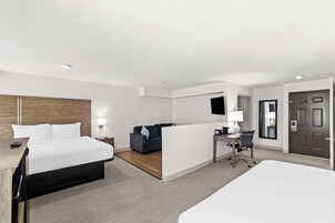 Suite, Multiple Beds, Non Smoking | Pillowtop beds, blackout drapes, iron/ironing board, rollaway beds